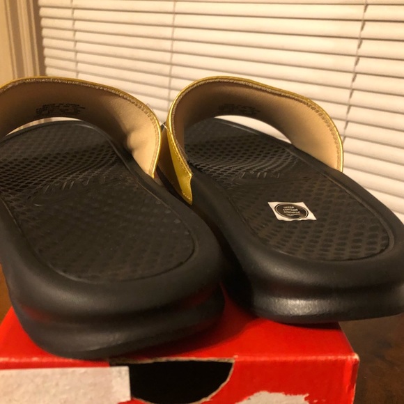 Women’s benassi gold Nike slides - Picture 4 of 5